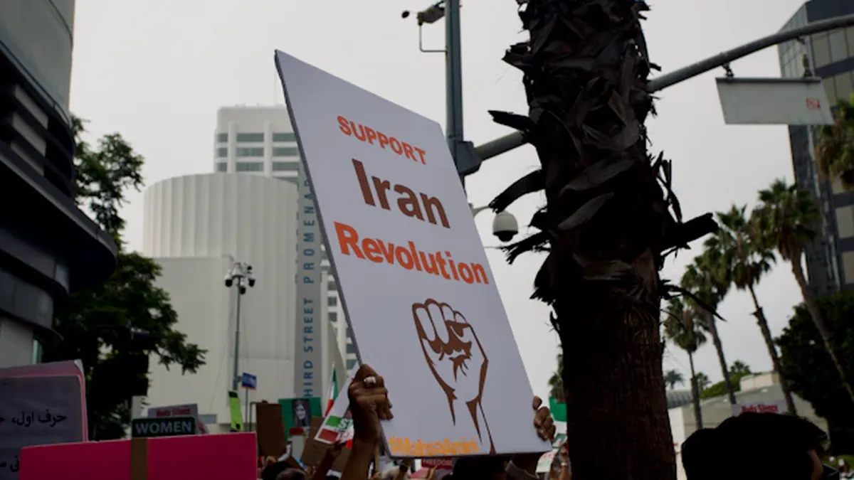 Iranian protesters demonstrating against government amid economic sanctions and regional conflicts